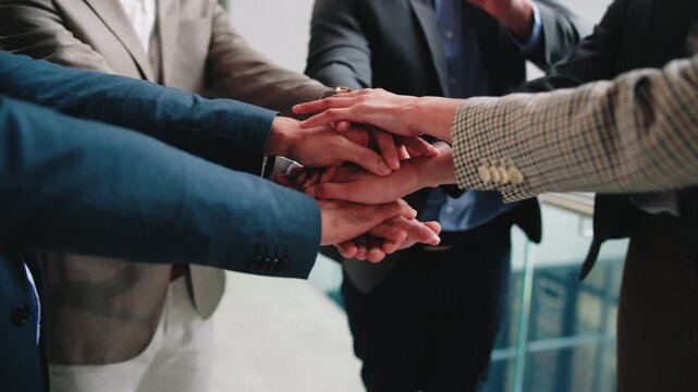 Business people, solidarity and hand stack in meeting, teamwork and unity for legal service or case. Corporate, lawyers and collaboration with colleagues, trust and partnership with group in law firm