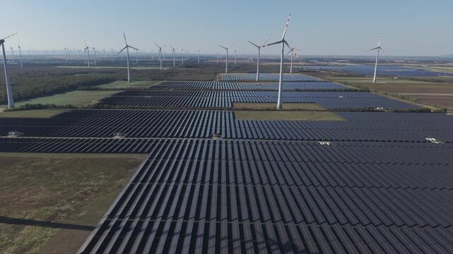Detailed aerial view of photovoltaic solar panels arranged in parallel rows