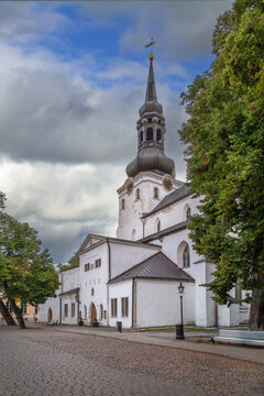 St Mary Cathedral facade view under partly cloudy sky in Tallinn, Estonia. Historic medieval architecture