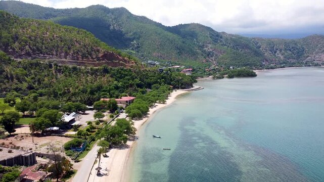 Aerial view coastal landscape with sandy beaches, ocean, mangroves and rugged hill landscape in Dili, Timor-Leste, Southeast Asia
