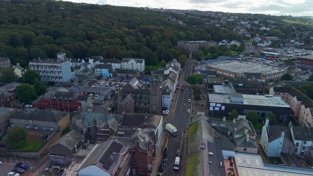 Aerial panoramic views of Whitehaven coastal town and civil parish. Demonstration of old Town architecture with roads and moving vehicles. Drone POV exploration of Devon County, England, UK.