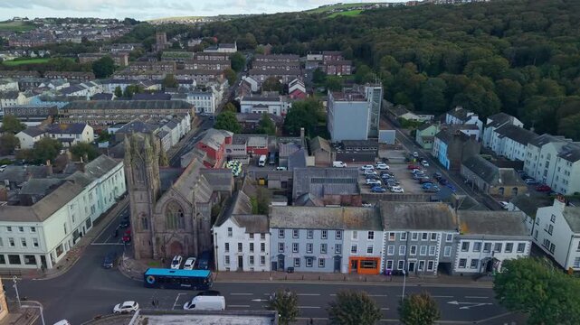 Aerial panoramic views of Whitehaven coastal town and civil parish. Demonstration of old Town architecture with roads and moving vehicles. Drone POV exploration of Devon County, England, UK.