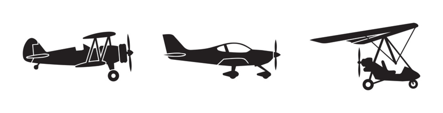 Airplane silhouettes set with biplane, propeller plane and ultralight, aviation and transport for logo