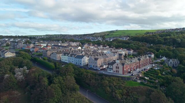 Aerial panoramic views of Whitehaven coastal town and civil parish. Demonstration of old Town architecture with roads and moving vehicles. Drone POV exploration of Devon County, England, UK.