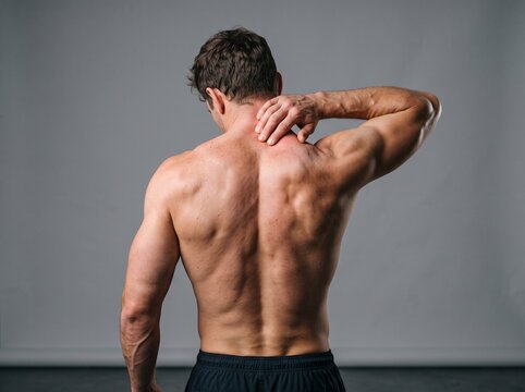 Person stretching arms back for shoulder and upper back flexibility exercise