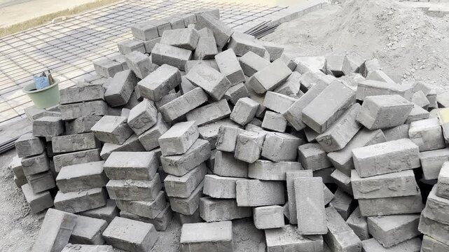 Pile of Concrete Paving Bricks on Construction Site