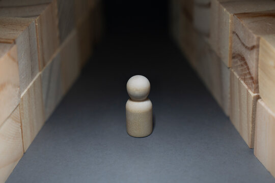 Uncertain future concept with person facing a dark unknown path
