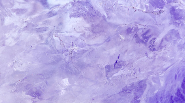 amethyst crystal displays frozen textures with cool Purple hues. The icy surface of the gemstone