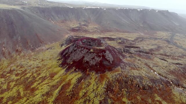Cinematic Aerial View of Eldborg Volcano Crater in Iceland Surrounded by Mossy Lava Fields