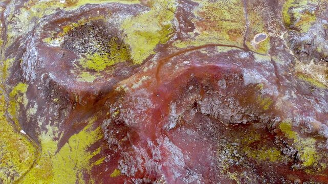 Aerial Top Down View of Eldborg Volcanic Crater in Iceland Showing Red Lava Rock and Moss Texture