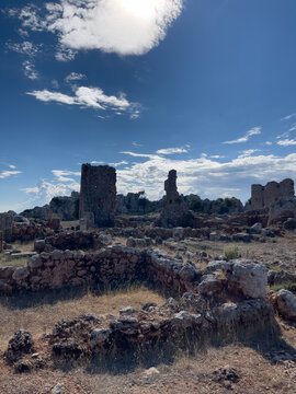   Archaeological site of Lyrboton Kome antique town. Historical stone walls and towers under bright sunlight in Antalya region, Pamphylia.