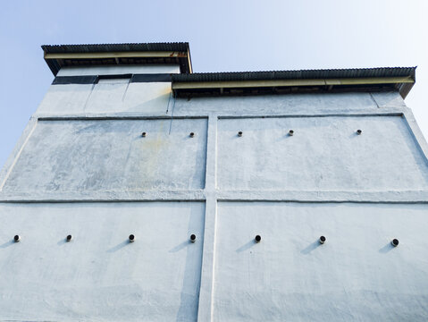 Exterior of a concrete swiftlet house building for edible bird nest farming.