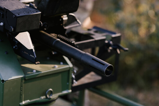 Machine gun barrel mounted on a military vehicle