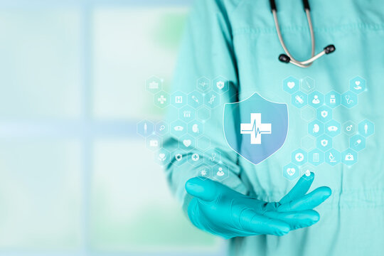 Doctor displaying an insurance shield. Digital health insurance system, innovative enrollment, and modern patient medical coverage management. Isolated with copy space.