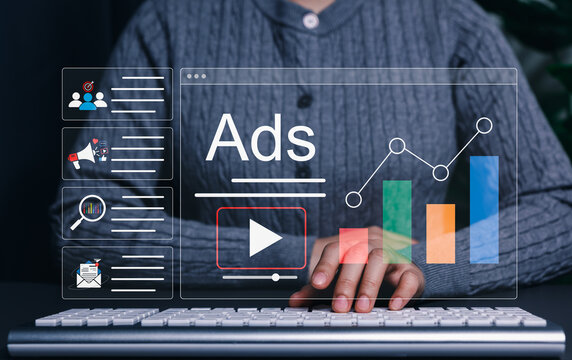 Digital Marketing and Online Advertising Strategy Concept. Marketer using computer with advertising icons, performance metrics, audience targeting, and campaign strategy analytics for online marketing