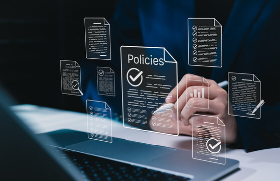 Policy documentation and compliance concept. Businesswoman reviews digital document Policies with icons, checklists, certifications, and financial detail. policy management, regulatory compliance,