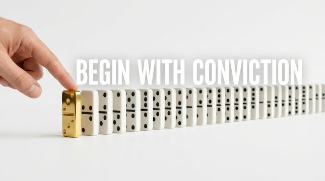 Finger pushing a golden domino to start a chain reaction of white dominos