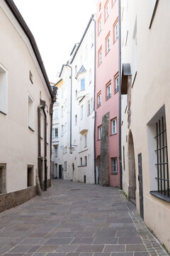 Narrow Paved Alley Between Buildings
