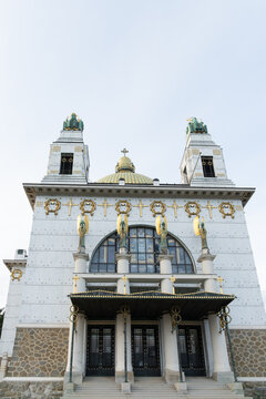 White Church Facade with Gold Decorative Details