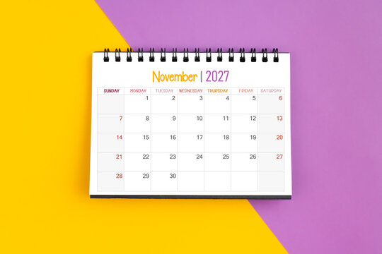 November 2027 Monthly desk calendar for 2027 year on yellow and purple color background.