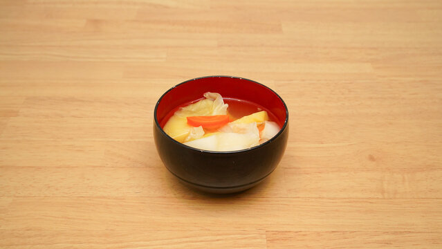 Bowl of vegetable miso soup on a table