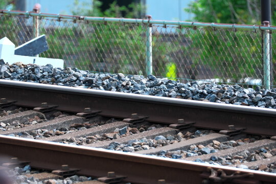 Train tracks with ballast stones and metal rails