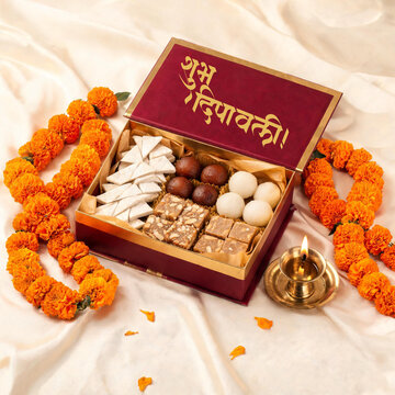 Diwali Sweet Box with Flowers Festive Celebration Background
