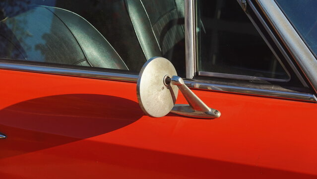 Vintage Red Car Chrome Details in Bright Sunlight