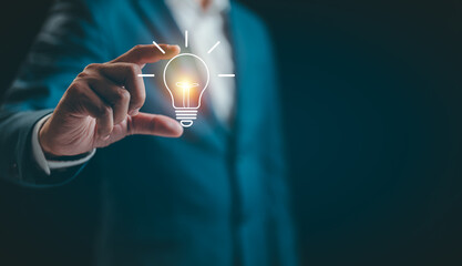 Businessman hand showing light bulb for thinking new idea concept. Innovative technology with innovation. Inspiration of ideas for sustainable business development and communication concepts © STPDC Studio
