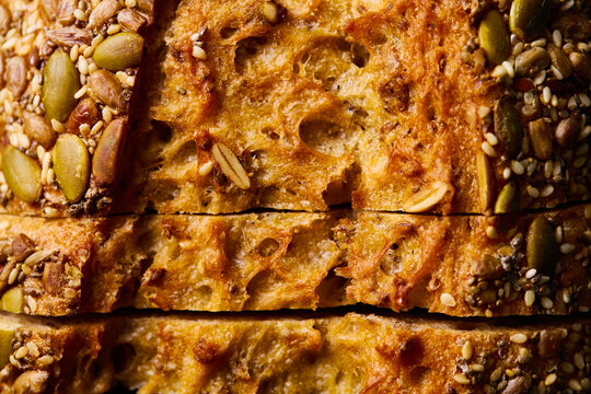 Sliced multigrain bread with pumpkin and sesame seed. Close up. Top view.