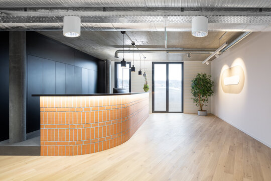 Modern coworking office interior with curved brick reception