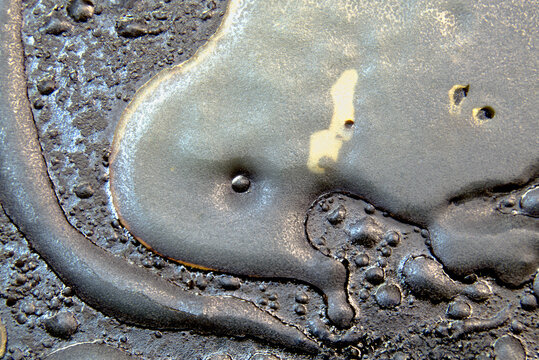 Congealed grease macro texture with metallic reflective surface
