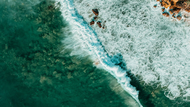Aerial view of turquoise waves on Puerto Rico coast