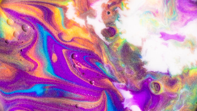 Vibrant fluid art with swirling rainbow pigments