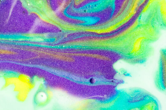 Vibrant purple and turquoise abstract fluid background