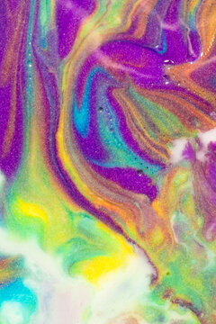Vibrant abstract fluid art with swirling iridescent colors