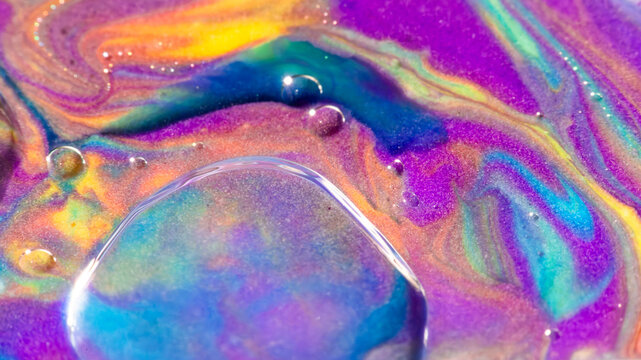 Vibrant iridescent liquid swirl with shimmering abstract texture