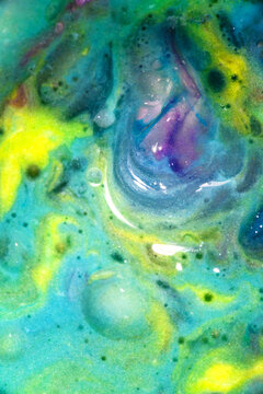 Colorful fluid paint texture with vibrant abstract swirls