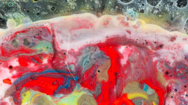 Colorful fluid paint texture with swirling abstract background