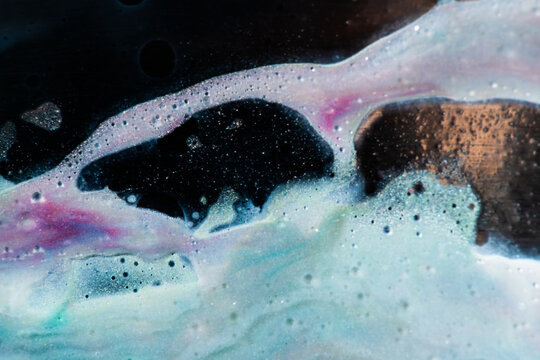 Abstract fluid art with pastel cells and dark contrast