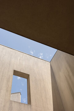 Geometric openings framing blue sky in Porto
