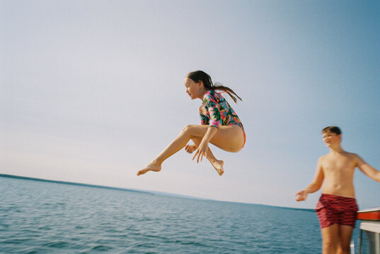 Girl Jumps into water at Lake family together Film