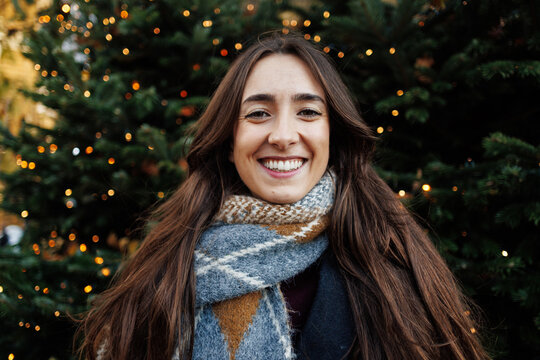 Happy young woman smiling during christmas season