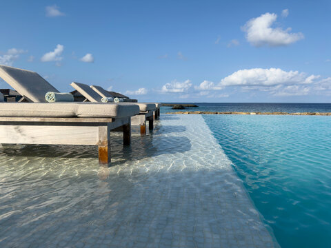 Sun lounges in the shallow pool at a luxury resort