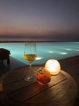 Sunset drinks by the pool in the Maldives
