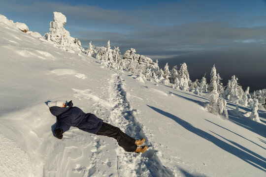 Lying in Winter Snow