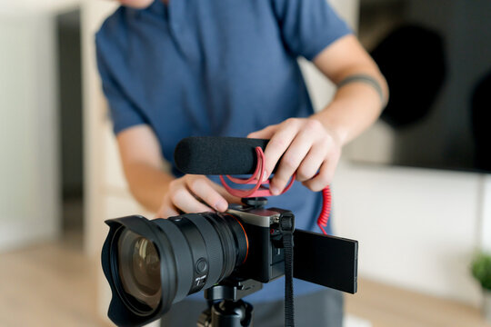 Content creator adjust camera microphone for video production