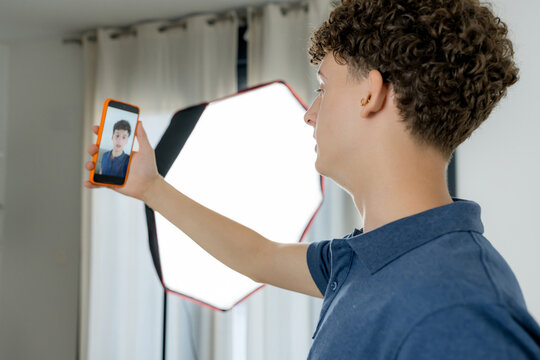 Content creator use smartphone for home video production