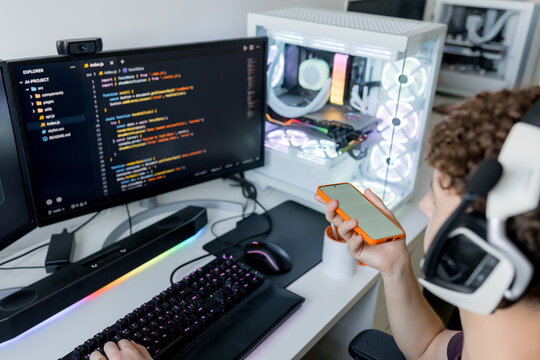 Young man use AI tools at gaming computer desk