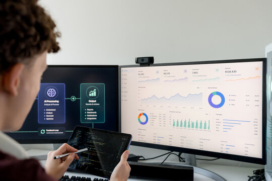 Young man analyzing AI tools and business data dashboard